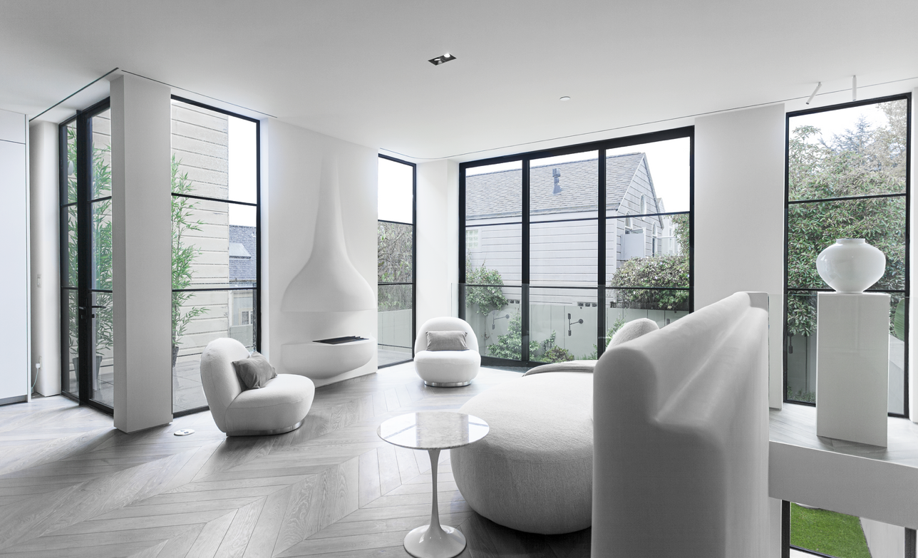 White living room with full-height glazing