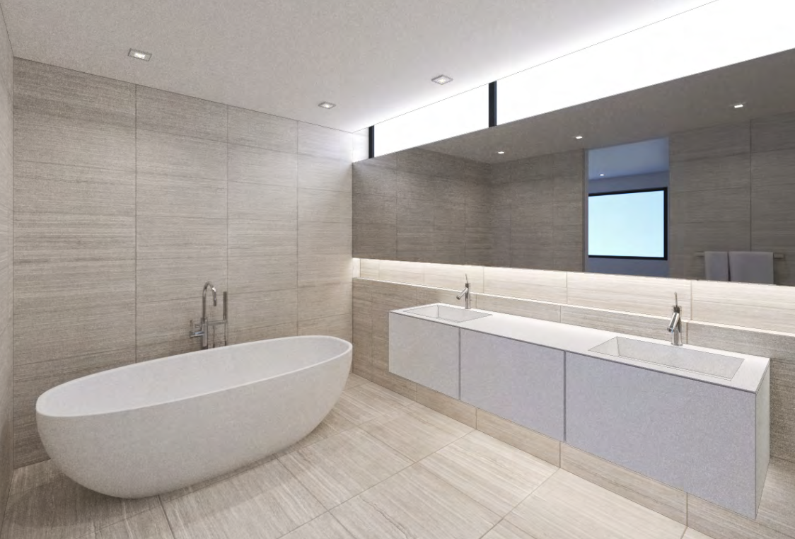 Primary bathroom with stone tile and freestanding tub