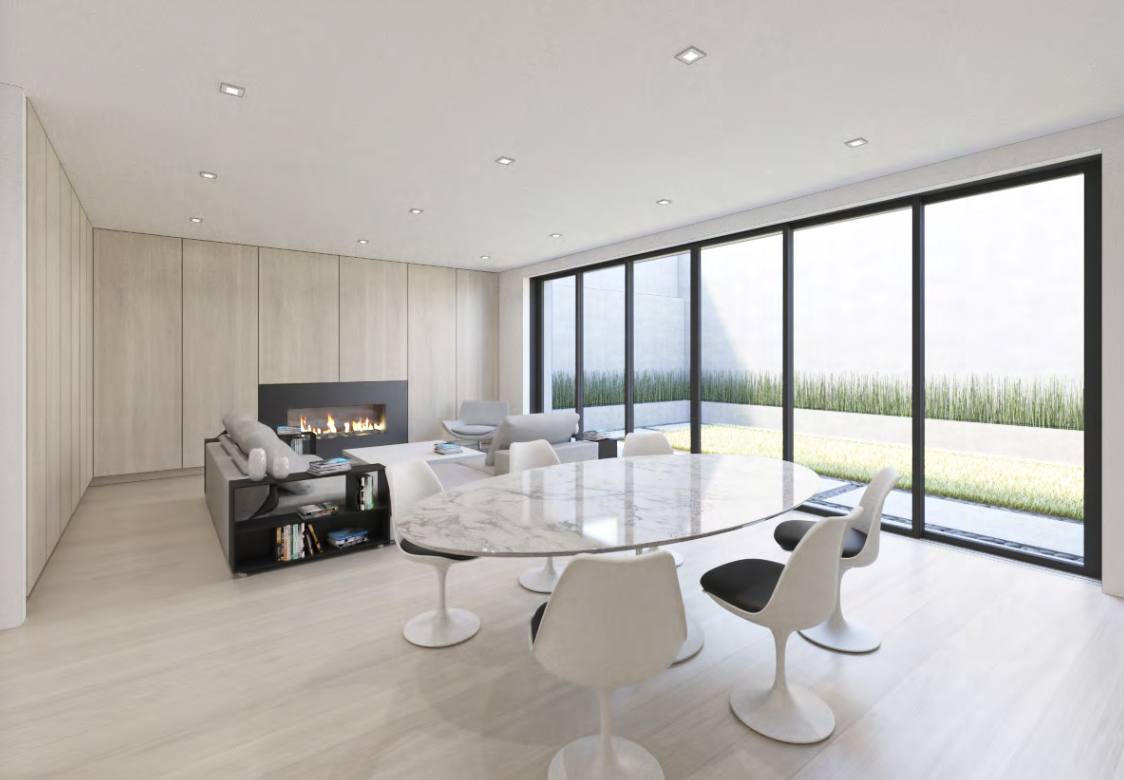 Dining and living space with fireplace and garden glazing