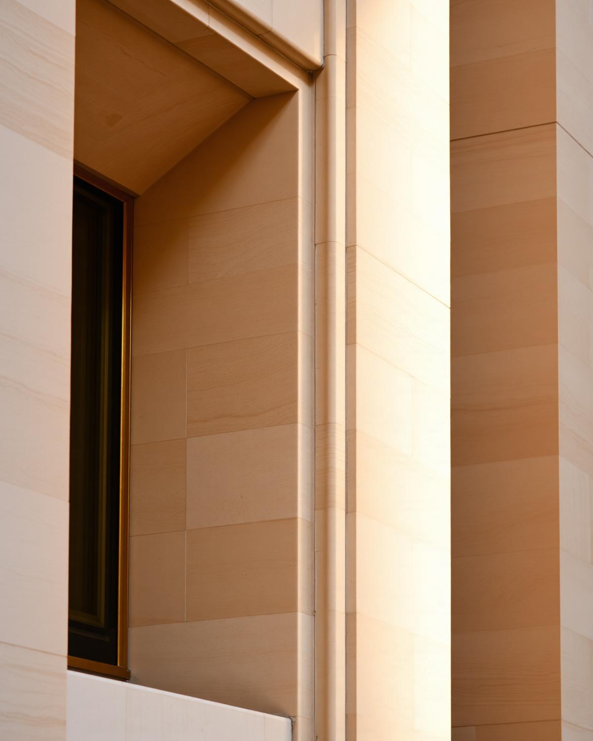 Detail of a stone facade in raking light